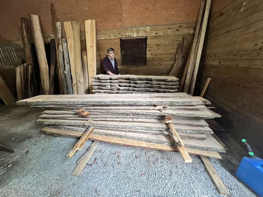 Stacked live-edge oak inventory